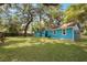 Light blue house with a large backyard at 2601 N Wilder Loop, Plant City, FL 33565