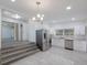 Modern kitchen with stainless steel appliances and white cabinets at 2601 N Wilder Loop, Plant City, FL 33565