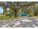 Cute light blue house with a long driveway at 2601 N Wilder Loop, Plant City, FL 33565