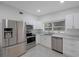 Modern kitchen with stainless steel appliances and white cabinets at 2601 N Wilder Loop, Plant City, FL 33565
