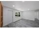 Renovated entryway with gray vinyl plank flooring at 2601 N Wilder Loop, Plant City, FL 33565