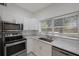 Modern kitchen with stainless steel appliances and white cabinets at 2601 N Wilder Loop, Plant City, FL 33565