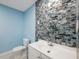 Updated bathroom with blue walls and vanity at 2601 N Wilder Loop, Plant City, FL 33565