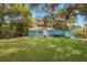 Charming light blue house with lush green lawn at 2601 N Wilder Loop, Plant City, FL 33565