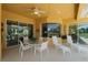 Covered patio with dining table and chairs, offering pool views at 1512 Parilla Cir, Trinity, FL 34655