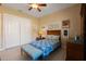 Guest bedroom with a full-size bed and built-in storage at 1512 Parilla Cir, Trinity, FL 34655