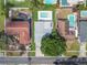 Aerial view of a residential property with a pool and neighboring houses at 5910 Denver Ne St, St Petersburg, FL 33703