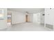 Open and airy living room with white walls and tile flooring throughout at 5910 Denver Ne St, St Petersburg, FL 33703