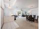 Open-concept living and dining area with neutral carpeting and ample natural light at 30315 Lettingwell Cir, Wesley Chapel, FL 33543
