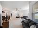 Living room with sofas, coffee table, and access to backyard at 30315 Lettingwell Cir, Wesley Chapel, FL 33543
