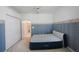 Bedroom with double bed and closet, offering ample space and natural light at 30315 Lettingwell Cir, Wesley Chapel, FL 33543