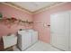 Laundry room with washer, dryer, and utility sink at 30315 Lettingwell Cir, Wesley Chapel, FL 33543