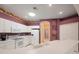 Bright kitchen with white cabinets, ample counter space, and modern appliances at 30315 Lettingwell Cir, Wesley Chapel, FL 33543