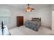 Comfortable bedroom with a ceiling fan, large closet, and ensuite bathroom access at 30315 Lettingwell Cir, Wesley Chapel, FL 33543