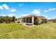 Relaxing screened patio with fire pit, perfect for outdoor entertaining at 30315 Lettingwell Cir, Wesley Chapel, FL 33543