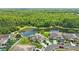 Community overview, showcasing homes near a pond and lush greenery at 30315 Lettingwell Cir, Wesley Chapel, FL 33543