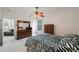 Spacious bedroom with a view to the living room, large closet and a zebra patterned bedding at 30315 Lettingwell Cir, Wesley Chapel, FL 33543
