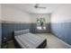 Bright bedroom with a queen-size bed and window view at 30315 Lettingwell Cir, Wesley Chapel, FL 33543