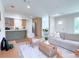 Open concept living room and kitchen with light and airy feel at 17476 Quentin Ave, Port Charlotte, FL 33954