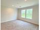 Spacious bedroom with carpet and two windows at 17476 Quentin Ave, Port Charlotte, FL 33954