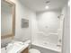 Bathroom with shower/tub combo, toilet, and vanity at 17476 Quentin Ave, Port Charlotte, FL 33954