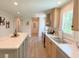 Modern kitchen with light wood cabinets and a large island at 17476 Quentin Ave, Port Charlotte, FL 33954