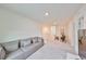 Spacious loft area with a comfortable couch and a small dining setting at 9018 Rally Spring Loop, Wesley Chapel, FL 33545