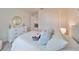 Charming bedroom featuring a white bed and built-in dresser at 9018 Rally Spring Loop, Wesley Chapel, FL 33545