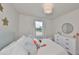 Serene bedroom with a full bed and dresser at 9018 Rally Spring Loop, Wesley Chapel, FL 33545
