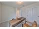 Home office with a wooden desk and comfortable chair at 9018 Rally Spring Loop, Wesley Chapel, FL 33545