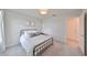 Simple bedroom with a queen bed and metal frame at 9018 Rally Spring Loop, Wesley Chapel, FL 33545