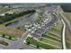 Aerial view of a residential neighborhood with a lake at 9018 Rally Spring Loop, Wesley Chapel, FL 33545