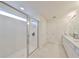 Modern bathroom with a walk-in shower and double vanity at 9018 Rally Spring Loop, Wesley Chapel, FL 33545