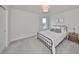 Modern bedroom with a queen bed and metal frame at 9018 Rally Spring Loop, Wesley Chapel, FL 33545