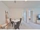 Bright bonus room with table and chairs, offering extra living space at 9018 Rally Spring Loop, Wesley Chapel, FL 33545