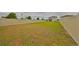 Large backyard with a vinyl fence and a grassy area at 9018 Rally Spring Loop, Wesley Chapel, FL 33545