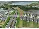 Aerial view of a house in a new development with lake views at 9018 Rally Spring Loop, Wesley Chapel, FL 33545