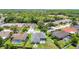 Aerial view displays the property's backyard, proximity to surrounding homes, and the community's green spaces at 28330 Openfield Loop, Wesley Chapel, FL 33543