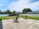 Spacious backyard with a tile patio area, offering a peaceful outdoor retreat at 28330 Openfield Loop, Wesley Chapel, FL 33543