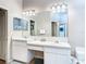Bright bathroom with dual sinks, large mirror, and plenty of cabinet space at 28330 Openfield Loop, Wesley Chapel, FL 33543