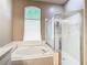 Bathroom featuring soaking tub, glass enclosed shower and natural light at 28330 Openfield Loop, Wesley Chapel, FL 33543