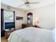 Comfortable bedroom with wood floors, ceiling fan, and natural light at 28330 Openfield Loop, Wesley Chapel, FL 33543