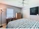 Cozy bedroom with wood floors, natural light, and ample closet space at 28330 Openfield Loop, Wesley Chapel, FL 33543