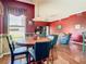 Dining room features a round wood table and seamless transition into the open living space at 28330 Openfield Loop, Wesley Chapel, FL 33543