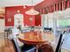 Dining area connecting to the living room and screened porch, perfect for gatherings and relaxation at 28330 Openfield Loop, Wesley Chapel, FL 33543
