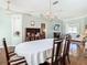 Spacious dining room featuring hardwood floors, modern lighting, and ample natural light at 28330 Openfield Loop, Wesley Chapel, FL 33543