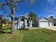 Charming home boasts a well-maintained lawn and beautiful landscaping at 28330 Openfield Loop, Wesley Chapel, FL 33543