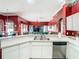 Kitchen area featuring stainless steel appliances and breakfast bar with a view of the living room at 28330 Openfield Loop, Wesley Chapel, FL 33543
