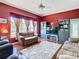 Comfortable living room with plush sofas, entertainment center, and a large window at 28330 Openfield Loop, Wesley Chapel, FL 33543