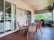 Inviting screened patio with a dining set and ceiling fan, perfect for outdoor relaxation at 28330 Openfield Loop, Wesley Chapel, FL 33543
